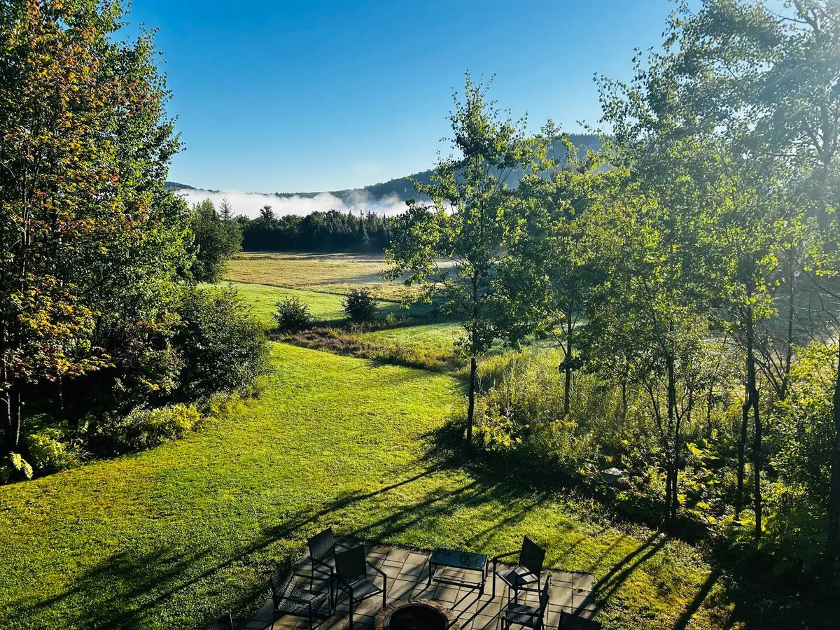 Morning mist lifting off the meadow behind Villa Foresta